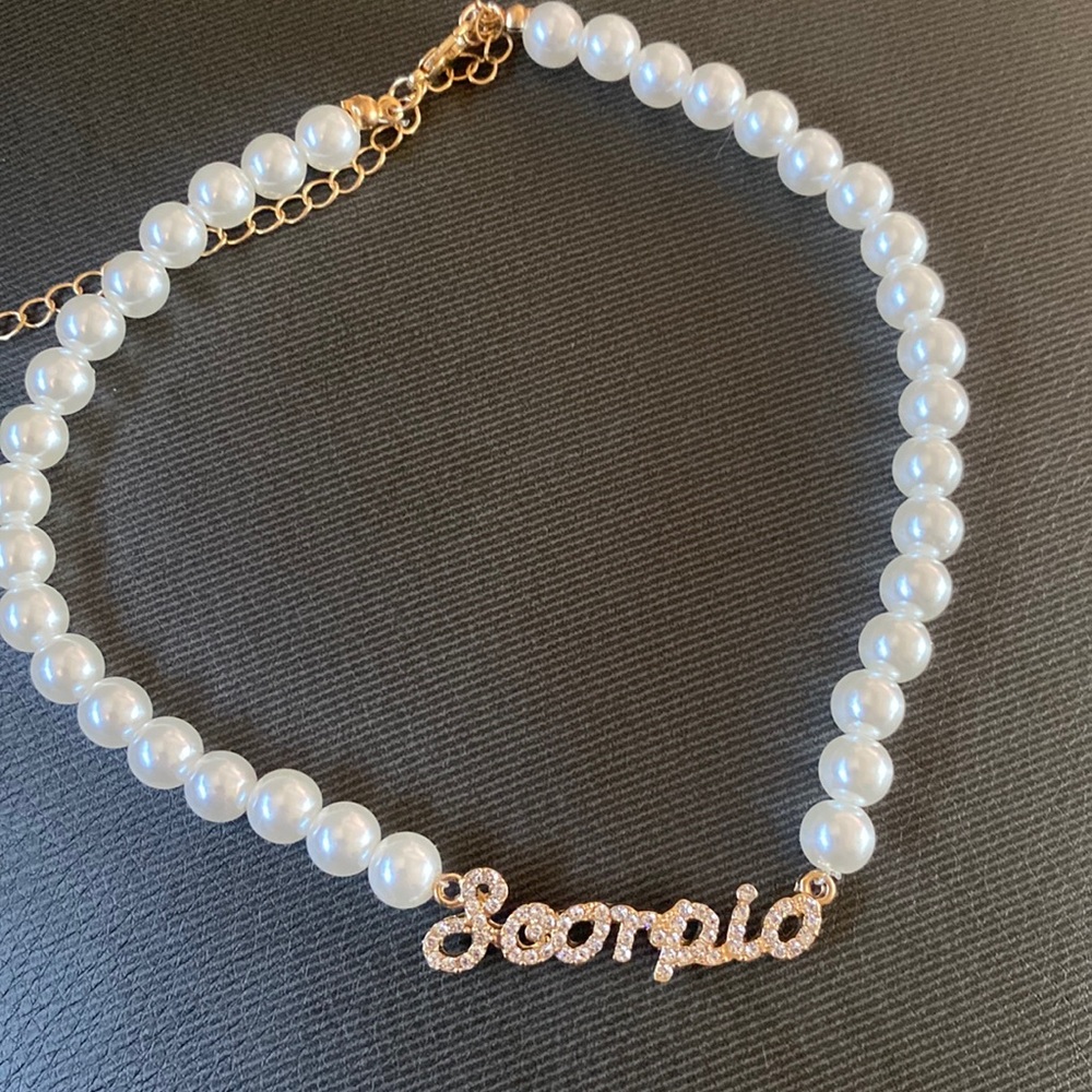 Costume jewelry pearl scorpio name